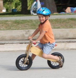 child on balance bike